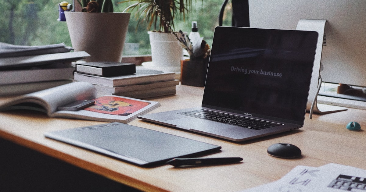 Stressed office worker with laptop experiencing AI burnout